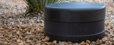 TruAudio SubTerrain burial subwoofer blended into landscape planting